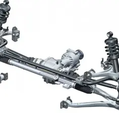 Układ zawieszenia samochodu z widocznym mechanizmem kierowniczym i dyferencjałem. Objawy uszkodzenia łącznika stabilizatora mogą być niepokojące.
